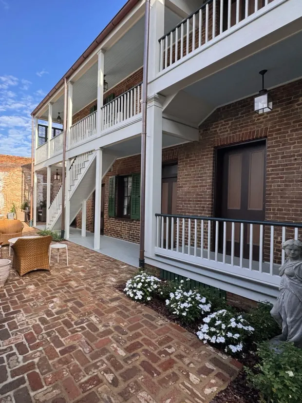 Galleried porches and brick courtyard at the Chighizola House